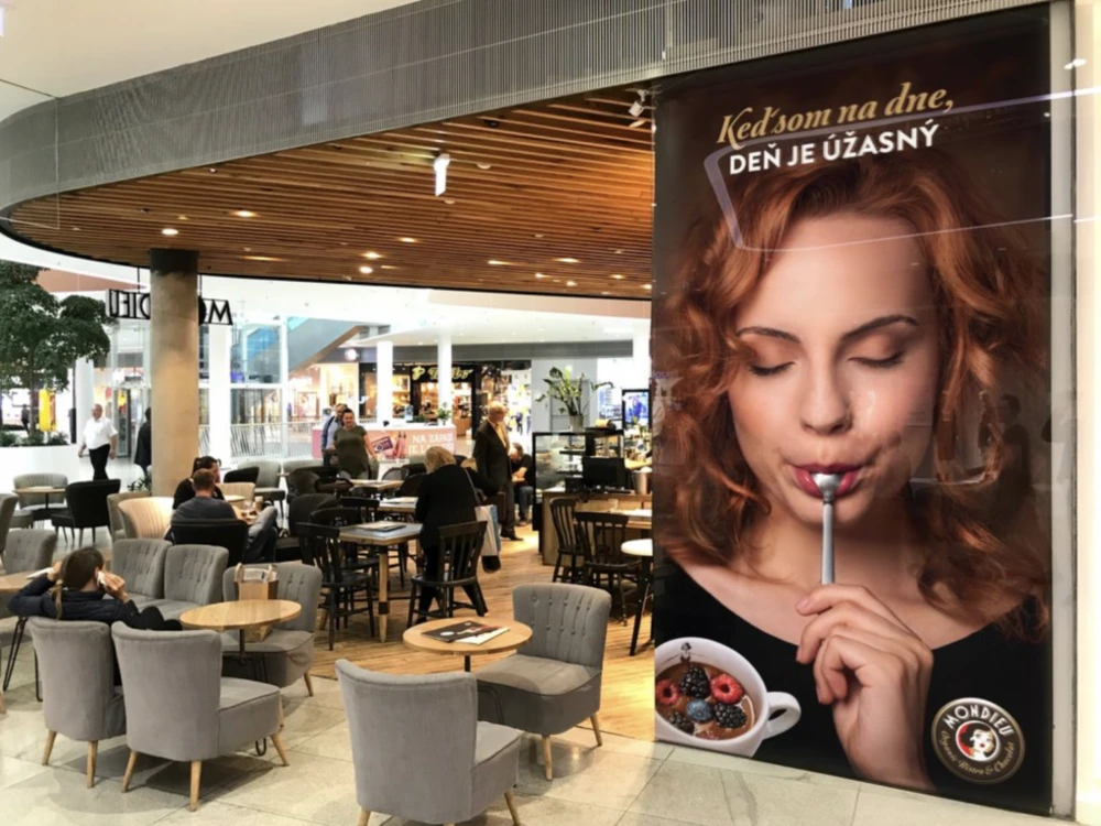 Mondieu café seating and campaign display at Bory Mall