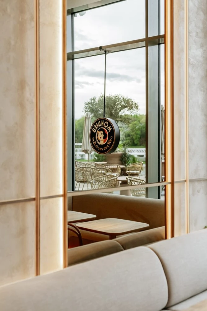 Glass entrance and café seating at Mondieu Eurovea 2