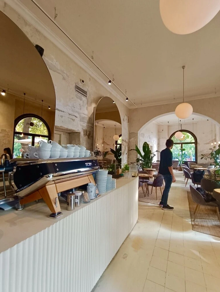 Bright café counter and seating at Mondieu Hviezdoslav Square