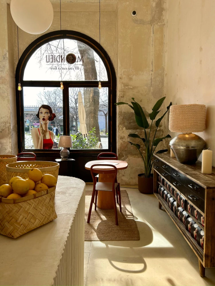 Sunlit lounge and bookcase inside Mondieu Hviezdoslav Square