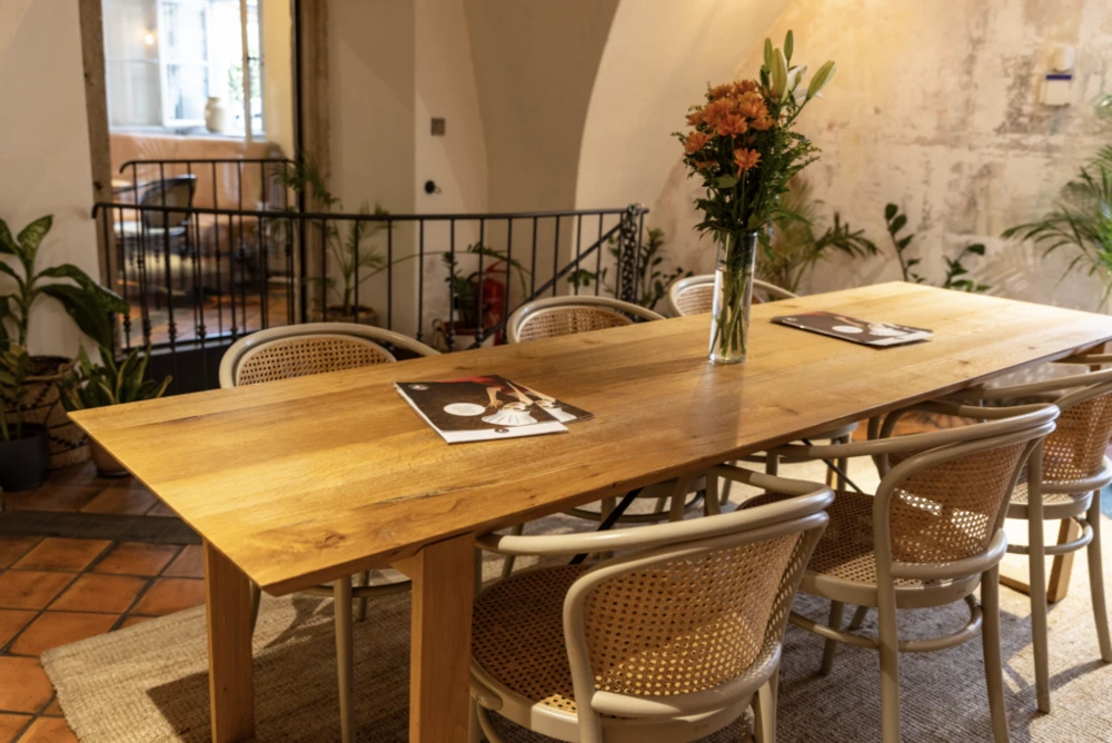 Rustic wooden table inside Mondieu Maltézské Square
