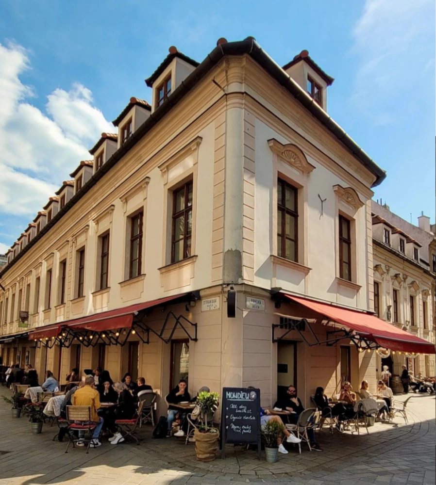 Historic building and outdoor seating at Mondieu Panská 27