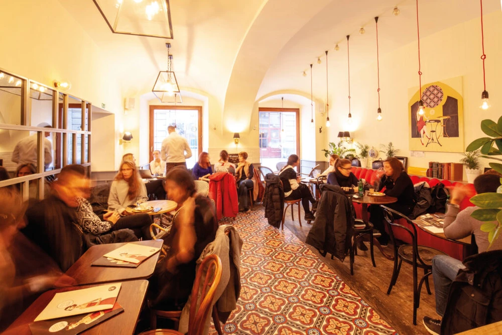 Lively café interior at Mondieu Panská 27 in Bratislava