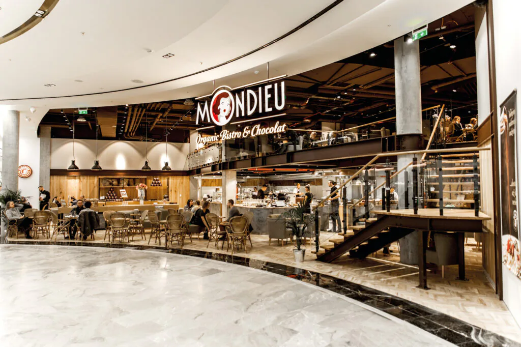Wide storefront of Mondieu café at Westfield Chodov in Prague